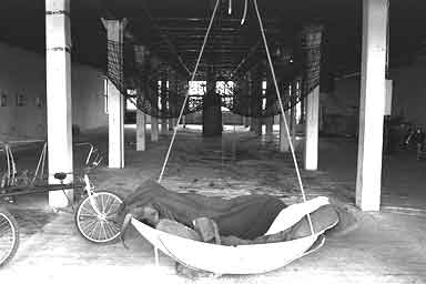 swing, four-person bike, and nets at che luis gallery art installation
