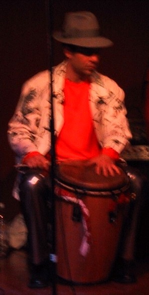 Eduardo de Soignee playing conga drum at Ritmo