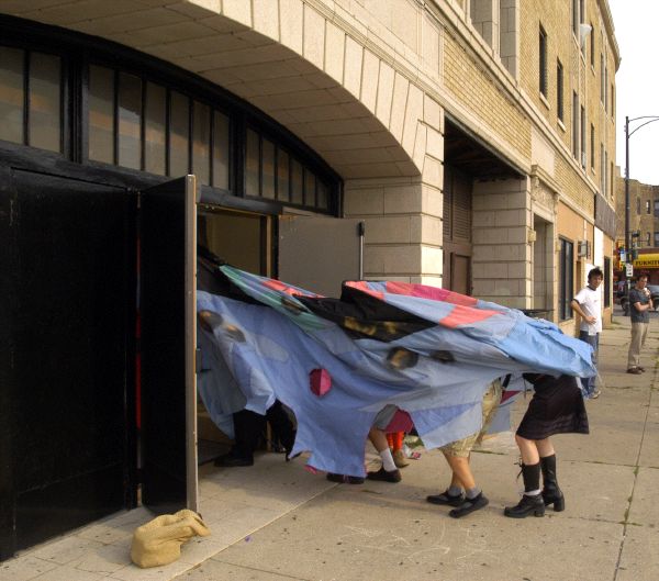 entering Congress theater in giant backpack puppet costume